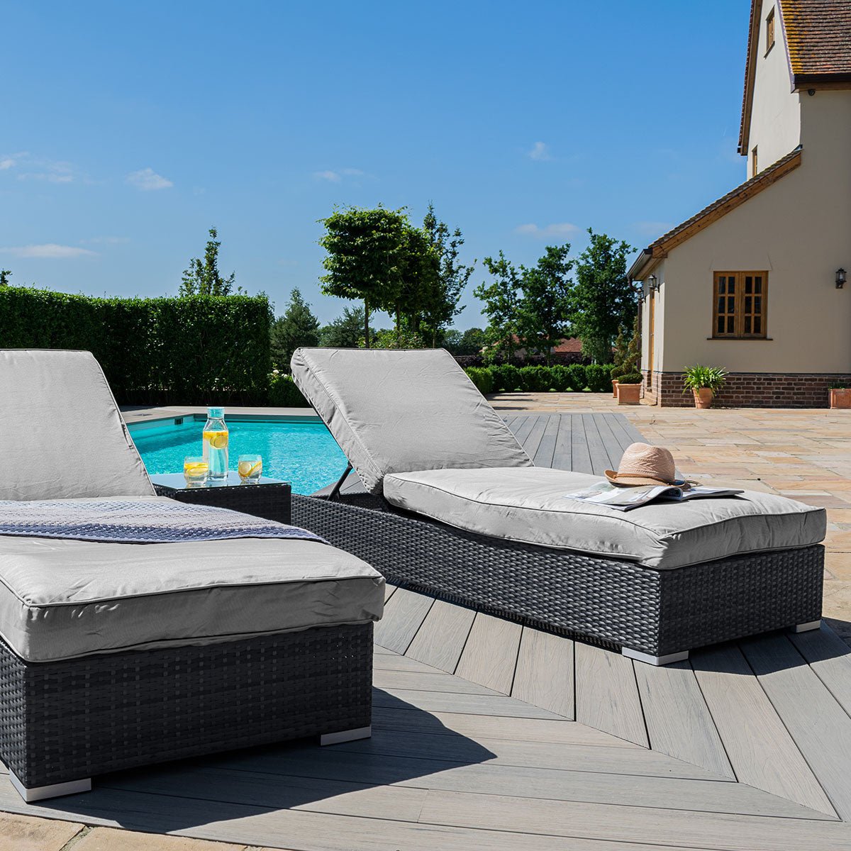 Pair of rattan sun loungers hot sale